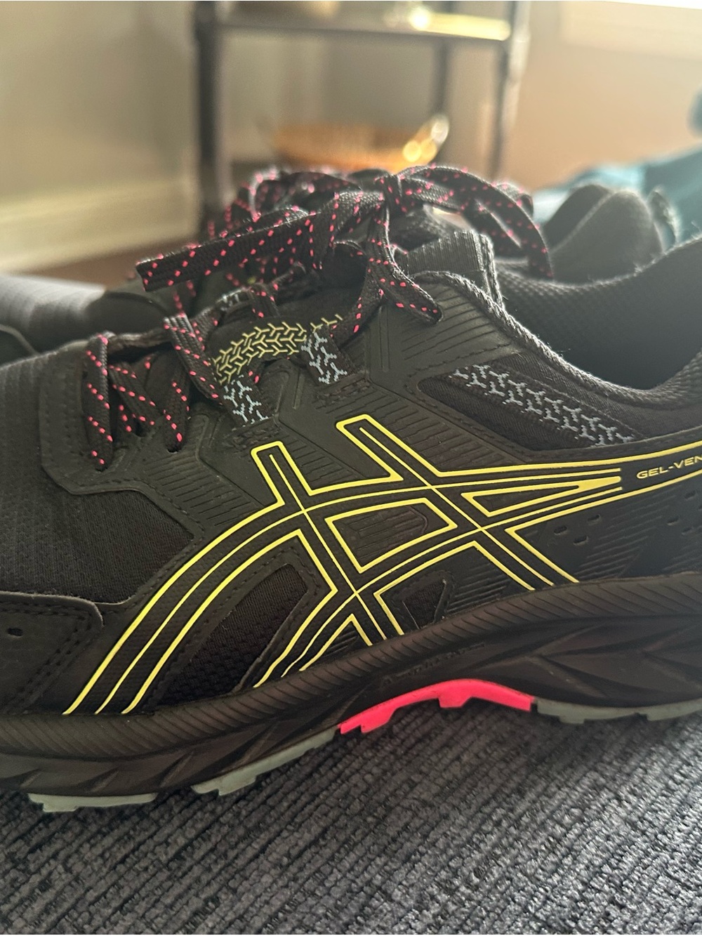 ASICS Black Athletic Shoe with Yellow Stripes and Pink Lace Detail